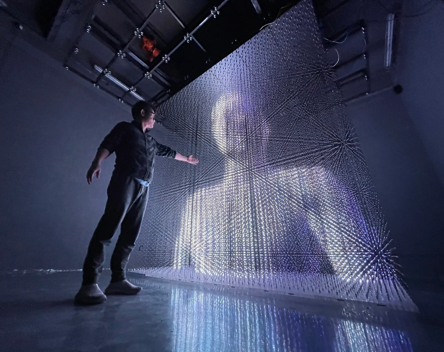 Volumetric LED display showing a 3D figure